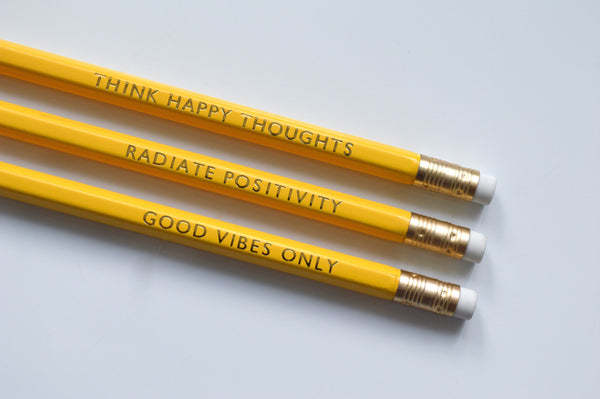 Gold Foiled happiness pencils reading: good vibes only, radiate positivity, think happy thoughts