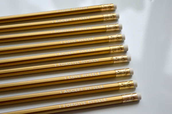Gold foiled affirmation pencils reading: I love myself, I accept myself, I forgive myself