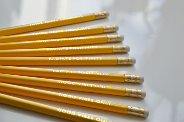 Gold Foiled happiness pencils reading: good vibes only, radiate positivity, think happy thoughts